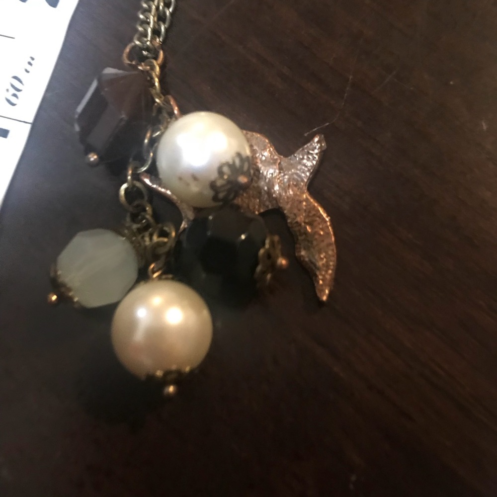 Bird charm necklace